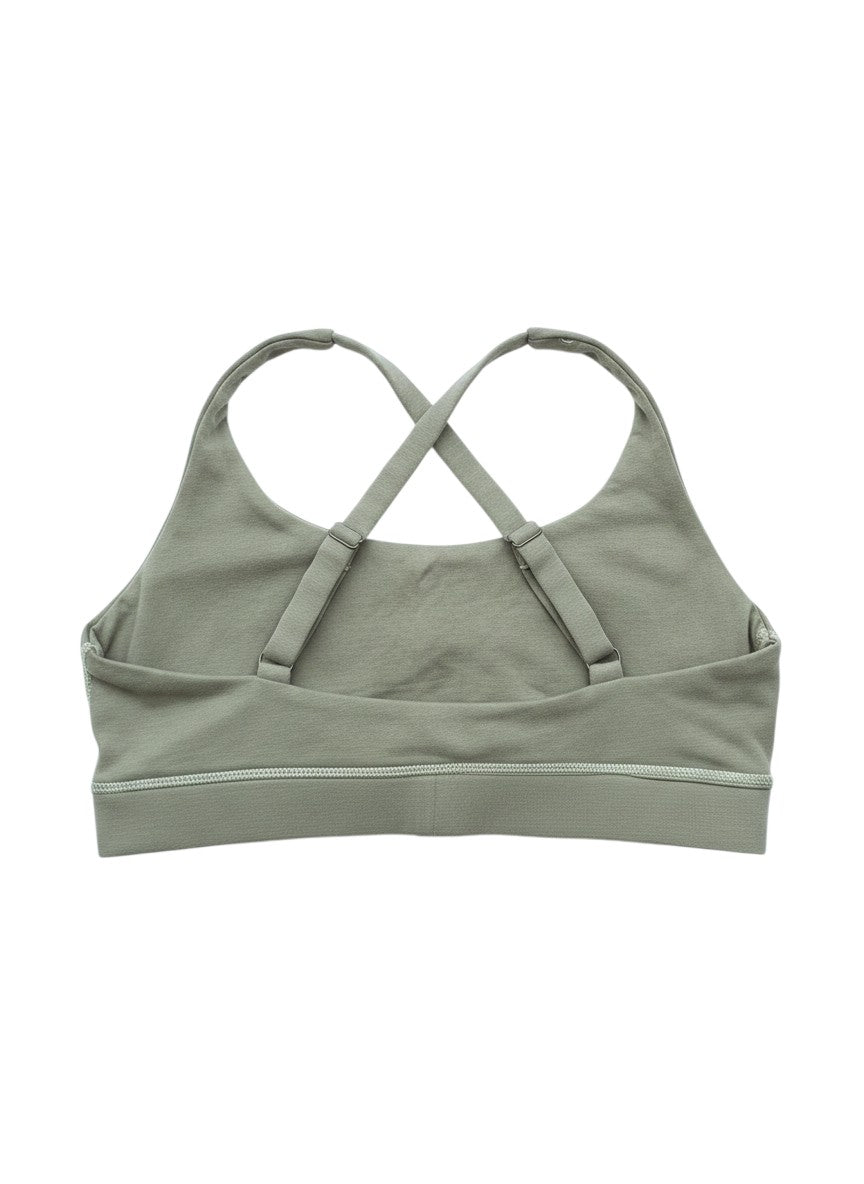 Flipflop and Treacle olive green organic cotton sports bra with criss-cross straps and adjustable sliders. Suitable for yoga, running, and swimming.
